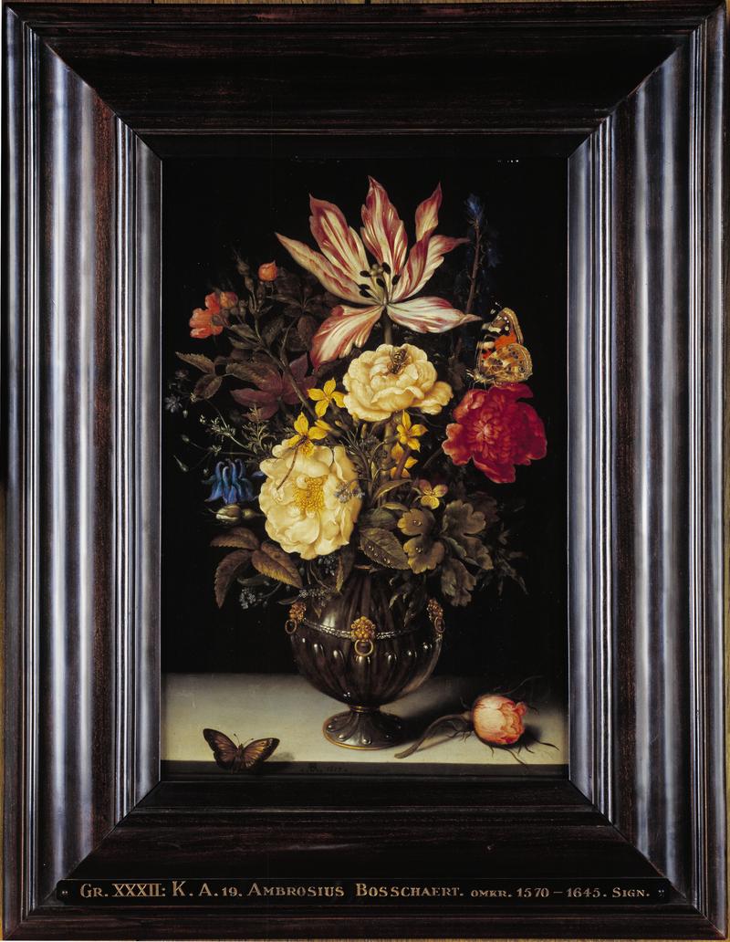 Flowers in a vase with insects